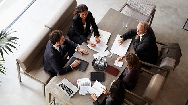 Executives meeting in a living room