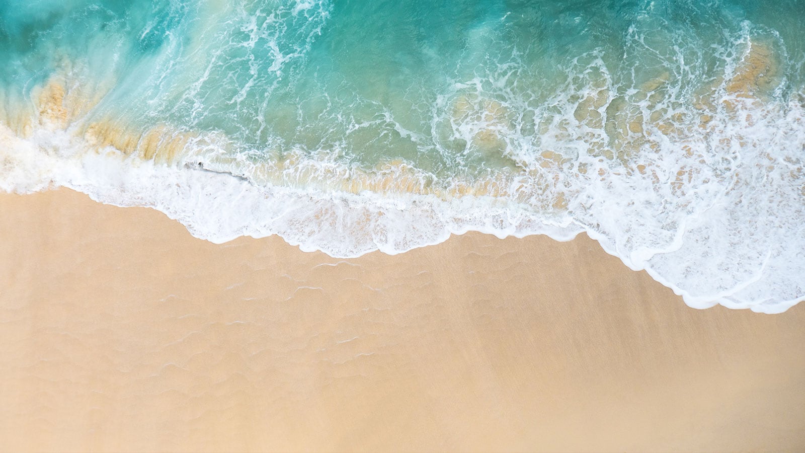 waves washing sand beach