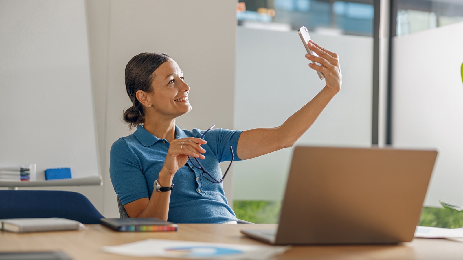 Businesswoman taking a selfie